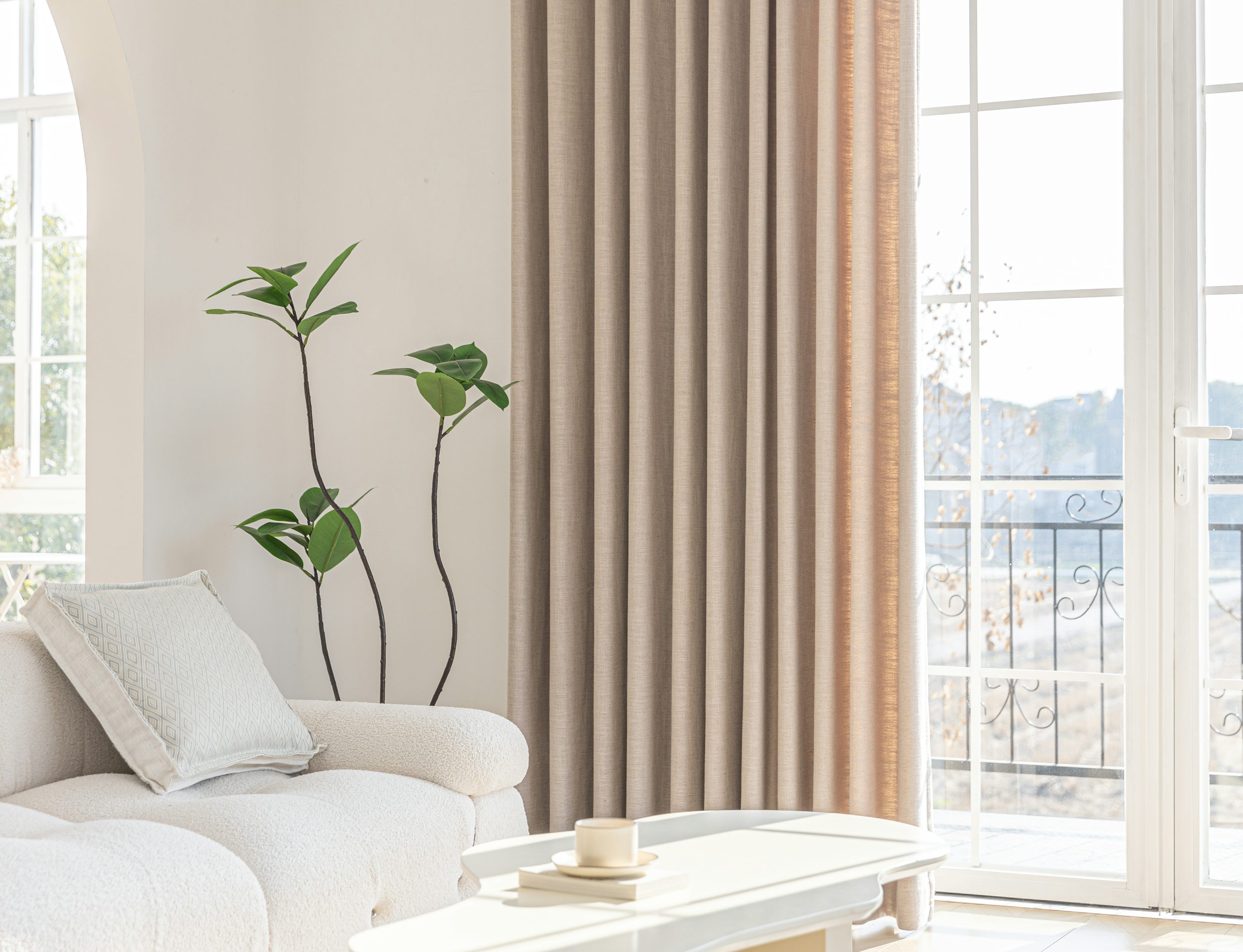 Soft curtains and daylight at a large window